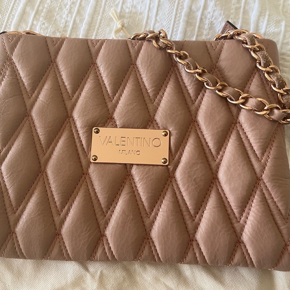 Pale pink Valentino clutch with gold leather chain